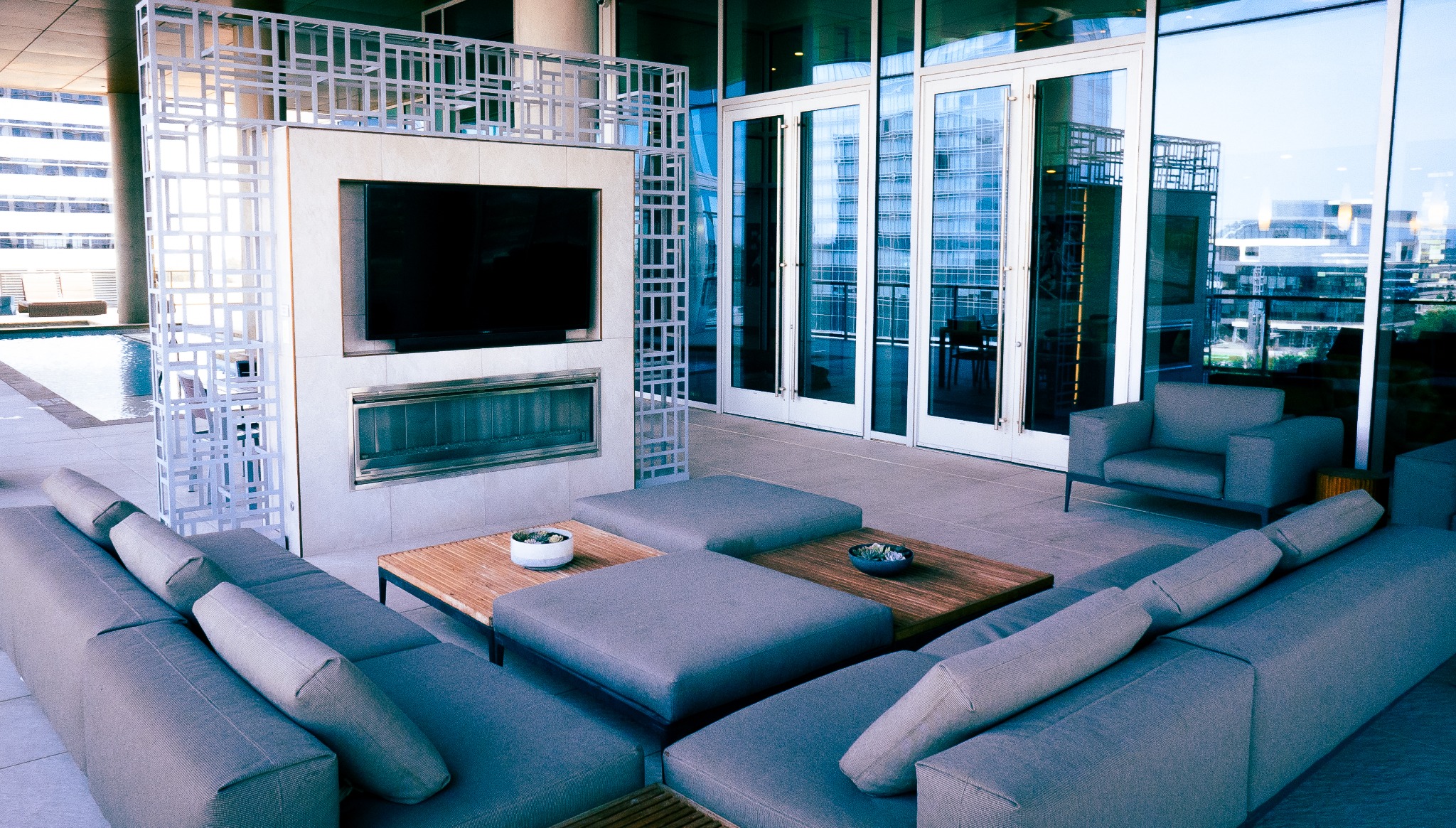 Outdoor lounge with television and seating